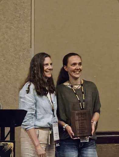 Leann Krieg, left, police communications director for the University of Wisconsin/Madison police department, presented Jackie Kortenhof, the Minocqua police department’s lead dispatcher, with the 2024 Wisconsin Telecommunicator Leadership Award on May 14 in Wisconsin Dells. (Contributed photograph)