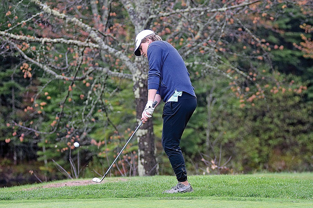 Rhinelander’s Sam Schoppe chips onto the green on the par-3 15th hole at Trout Lake Golf Club in Arbor Vitae during the final round of the GNC golf tournament Thursday, May 16. Schoppe shot 81 to finish 10th on the day and sixth in the final conference standings. (Brett LaBore/Lakeland Times)