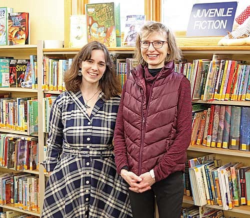 Library director of 33 years Janelle Kohl (right) is working with up-and-coming director Callie Bates to teach her the ropes before her retirement which begins on June 1. (Photo by Michelle Drew/Lakeland Times)