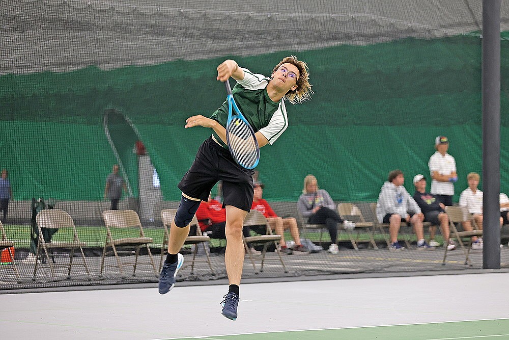 Rhinelander’s Zacha King hits a serve during a WIAA Division 1 boys’ tennis subsectional in the Hodag Dome Monday, May 20. King won both of his matches at No. 4 singles as the Hodags advanced five of their seven flights through to the sectional round of the WIAA tournament. (Bob Mainhardt for the River News)