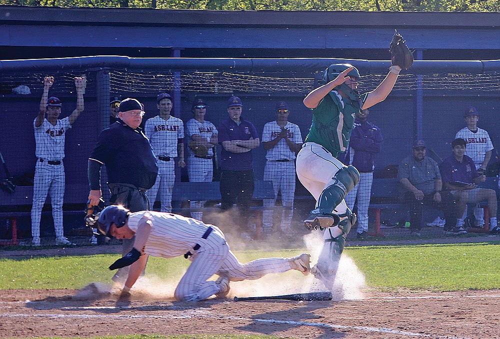 Ashland’s Wyatt Lund beats a throw to the plate, fielded by Rhinelander catcher Chandler Servent, during a WIAA Division 2 regional quarterfinal baseball game at Ashland Thursday, May 23. Lund scored the tying run, and Ashland scored three times in the fifth to defeat the Hodags, 3-1. (Bob Mainhardt/River News)