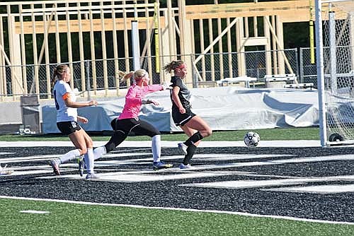 Avery McKinney gets by Mosinee goalie Morgan Hoernke and scores a goal in the first half of a WIAA Division 3 regional semifinal game Thursday, May 30 at IncredibleBank Field in Minocqua. (Photo by Brett LaBore/Lakeland Times)