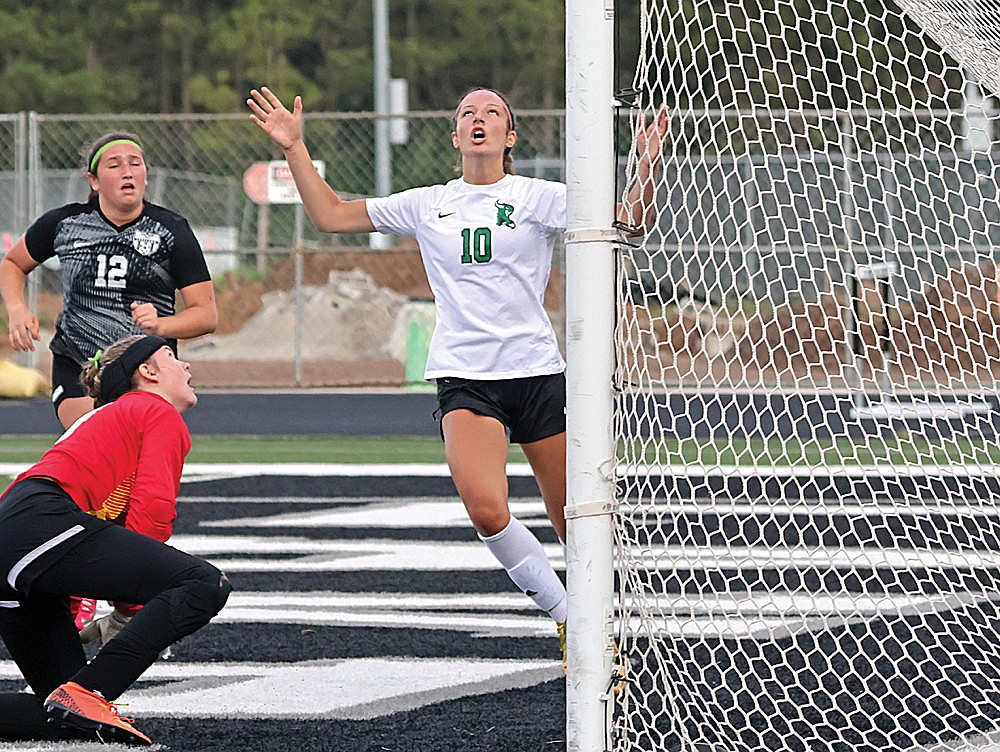 Rhinelander’s Lindsey Hoerchler reacts after missing high on a rebound chance against Lakeland goalkeeper Ava Evenhouse during the second half of a WIAA Division 3 girls’ soccer regional final game against Lakeland in Minocqua Saturday, June 1. The Hodags lost the game, 1-0. (Jeremy Mayo/River News)