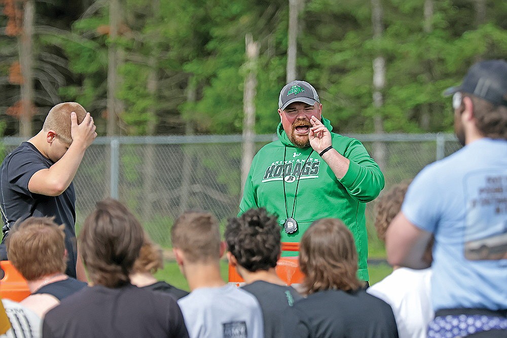 Rhinelander High School football coach Aaron Kraemer addresses his team during a mini-camp at Mike Webster Stadium, Thursday, June 6. The Hodags used one of the five coaching contact days allotted by the WIAA during the course of the summer for the mini camp. (Jeremy Mayo/River News)
