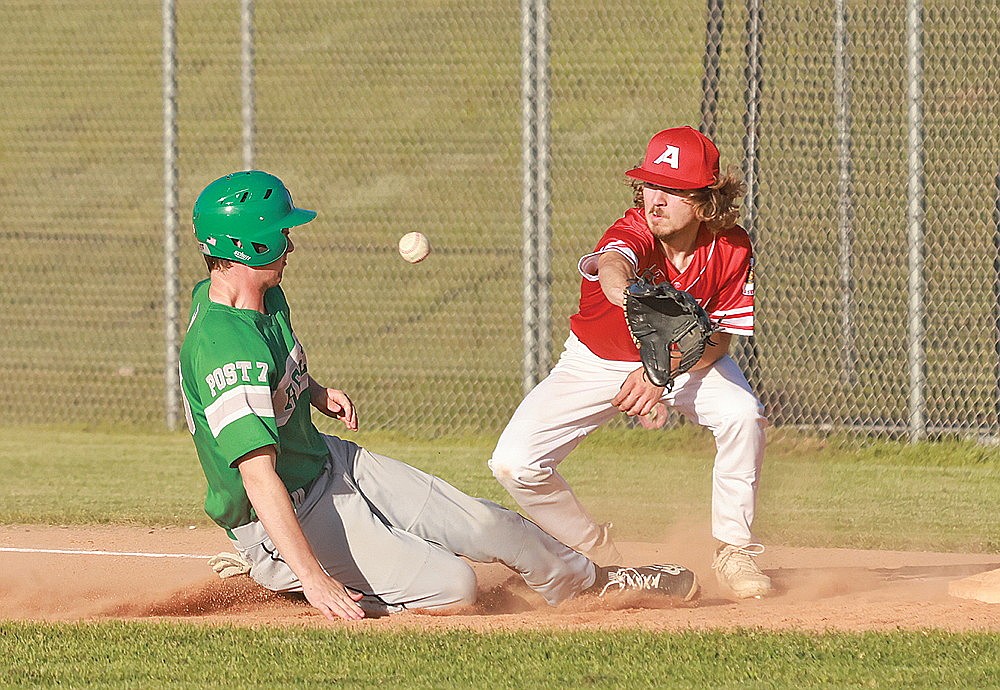 Rhinelander’s Sam Schneider slides back to first base while Antigo’s Alec Knapkavage attempts to field a rundown attempt during the third inning of an American Legion baseball game at Stafford Field Monday, June 10. Schneider was safe on the play and eventually scored on a wild pitch. Rhinelander lost the game 13-2. (Bob Mainhardt for the River News)