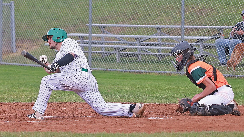 Rhinelander’s Ben Quade hits a two-run single during the first inning of a Dairyland League baseball game against Minocqua at Stafford Field Sunday, June 16. Quade’s hit proved to drive in the winning run as the River Monsters defeated the Wood Ducks, 3-1. (Bob Mainhardt for the River News)