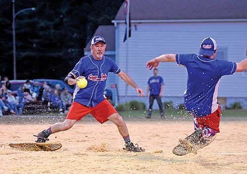 Jeff Smith steps on second base before making the throw to first in the snowshoe baseball season opener Monday, June 17 at Snowshoe Park in Lake Tomahawk. (Photo by Brett LaBore/Lakeland Times)