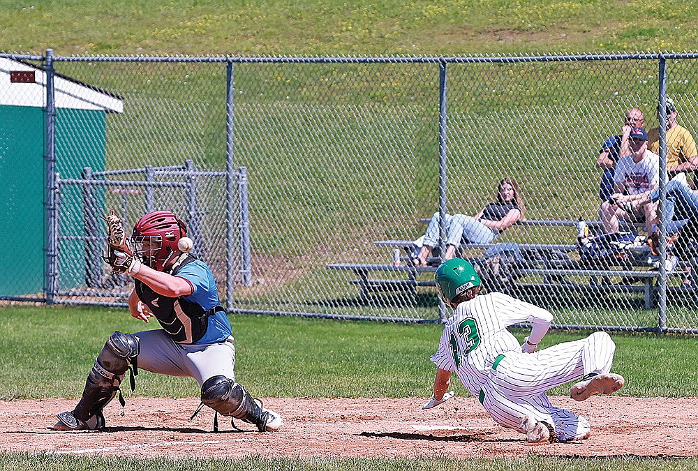 Rhinelander’s Josh Randolph beats a throw to the plate that escapes the glove of Marshfield catcher Ben Dietsche during the sixth inning of a Dairyland League baseball game at Stafford Field Sunday, June 23. Rhinelander scored three runs as three errors were committed on the play and went on to a 6-2 victory over the Chaparrals. (Bob Mainhardt for the River News)