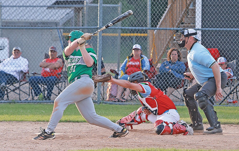 Rhinelander’s Tyler Chariton swings at a pitch during the sixth inning of an American Legion baseball game at Crandon Monday, June 24. Chariton hit a home run Tuesday night at Medford as the Rebels rallied from down 12-0 in the fifth to fall with the Raiders, 12-7. (Bob Mainhardt for the River News)