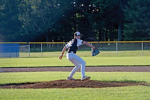 Drew Warren goes through his pitching motion against Eagle River Wednesday, June 26 at Northland Pines High School in Eagle River. Warren pitched three shutout innings. (Photo by Brett LaBore/Lakeland Times)