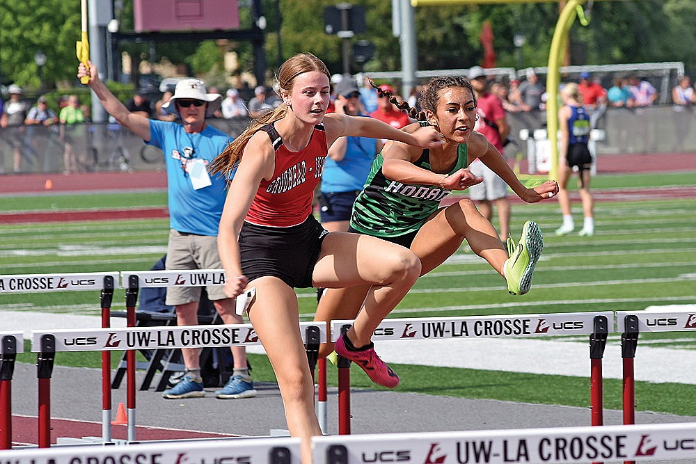 In this May 31, 2024 file photo, Rhinelander’s Aila Bergman races Brodhead/Juda’s Addison Yates in the D2 girls’ 100-meter hurdles during the WIAA state track and field meet in La Crosse. In addition to competing at state in the 100 hurdles, Bergman broke her own school record in the 300 hurdles at sectionals. (Brett LaBore/Lakeland Times)