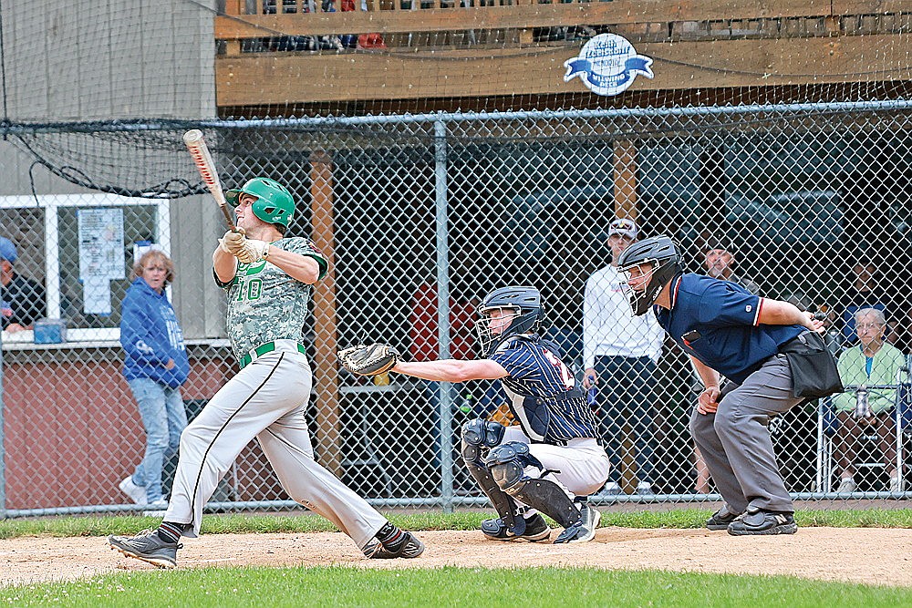 Rhinelander’s Sam Schneider hits a sacrifice fly during the second inning of an American Legion baseball game against Chippewa Falls in Merrill Saturday, June 29. Schneider had three hits and four RBIs as the Rebels won the game, 10-3. (Bob Mainhardt for the River News)