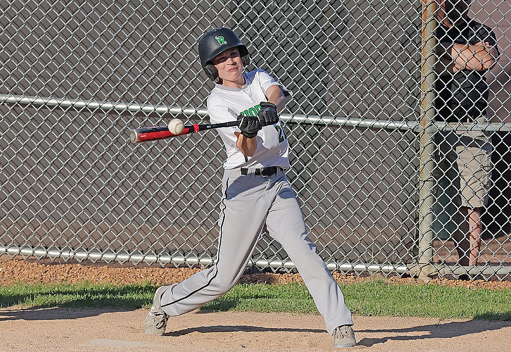 Jaxson Kremer hits a solo home run during the fifth inning of a Little League District 5 tournament game at Merrill Monday, July 1. (Jeremy Mayo/River News)