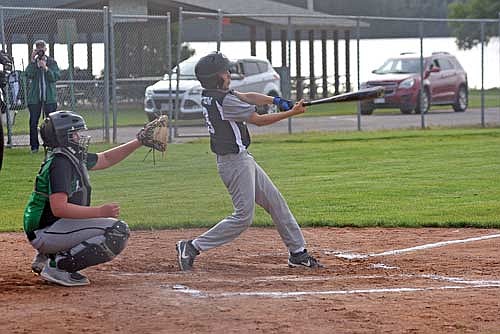 Dennis Two Crow, who played catcher for Lakeland, digs in to swing at a pitch in the top of the third inning. (Photo by Mikey Rottier/Lakeland Times)