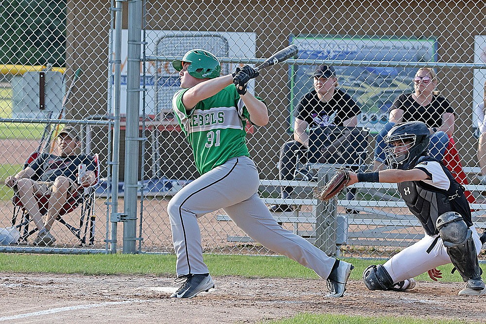 Rhinelander’s Tyler Chariton hits an RBI single during the third inning of an American Legion baseball game at Minocqua Wednesday, July 3. Chariton came up with a bigger RBI hit on Friday, a walk-off single that completed Rhinelander’s four-run rally in the seventh inning to defeat the 89ers, 6-5. (Jeremy Mayo/River News)