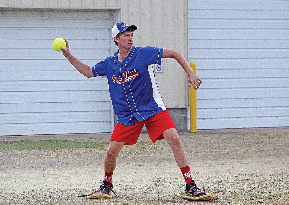 Ryan Morien throws the ball to the cut-off man from left field during a snowshoe baseball game between the Lake Tomahawk Snowhawks and the Chicago All-Stars Thursday, July 4 in Lake Tomahawk. Morien, a rookie, drove in the game-winning run Thursday as the Snowhawks defeated the All-Stars, 12-11. (Trevor Greene/Lakeland Times)