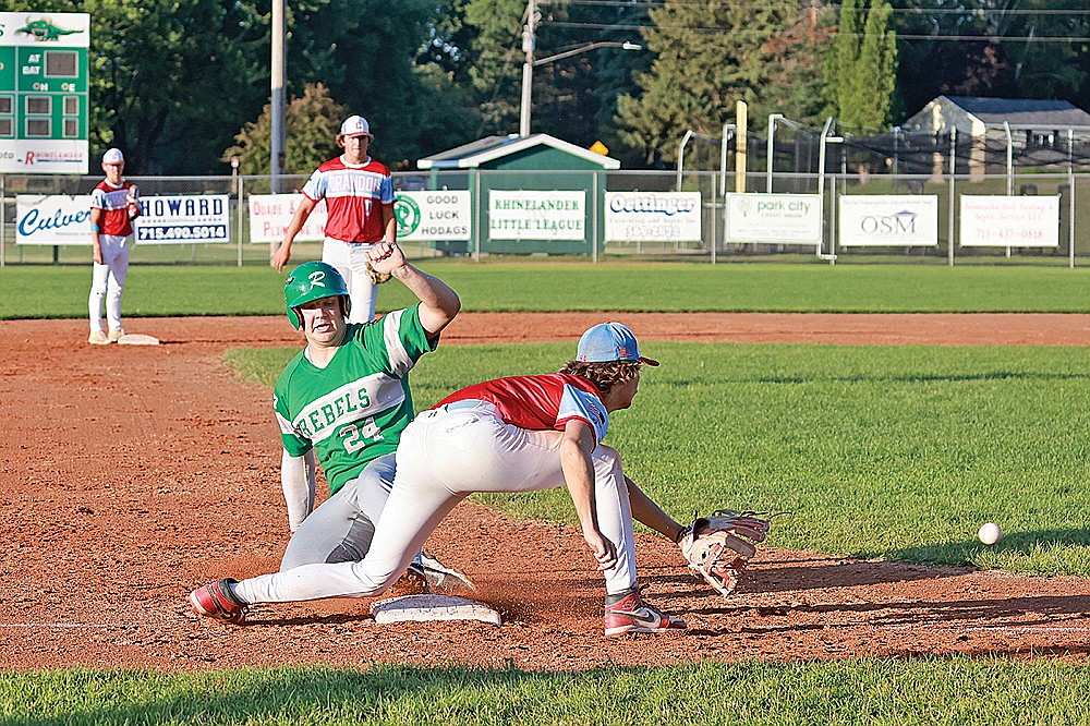 Rhinelander’s Owen Kurtz beats a throw to third following a groundout during the second inning of an American Legion baseball game against Crandon at Stafford Field Monday, July 8. (Bob Mainhardt for the River News)