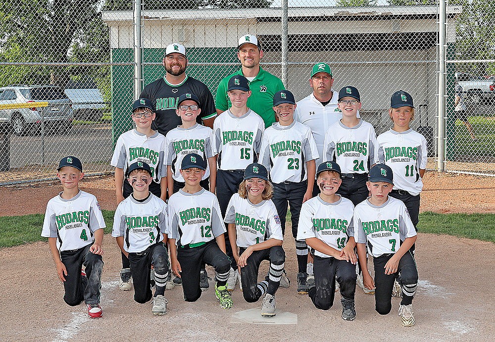 ]The Rhinelander Hodag 10U All-Star Team poses for a photograph following a District 5 tournament game in Rhinelander Tuesday, July 9. Pictured in the front row, from left to right, are Max Maufort, Braxton Bolkema, Easton Rady, Cooper Clark, Derek Jorata and Mason Paulson. In the second row are Gage Dantoin, Watson White, Easton Ostrom, Rylan Pasanen, Isaac Bauer and Colt Waksmonski. In the back row are coaches Josh Clark, Keith White and Brian Paulson. (Bob Mainhardt for the River News)