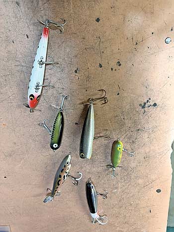 Prop baits come in a variety of colors and sizes. They are meant to make a commotion as they are retrieved across the top of the water, enticing even the most finicky fish to bite. (Photo by Beckie Gaskill/Lakeland Times)