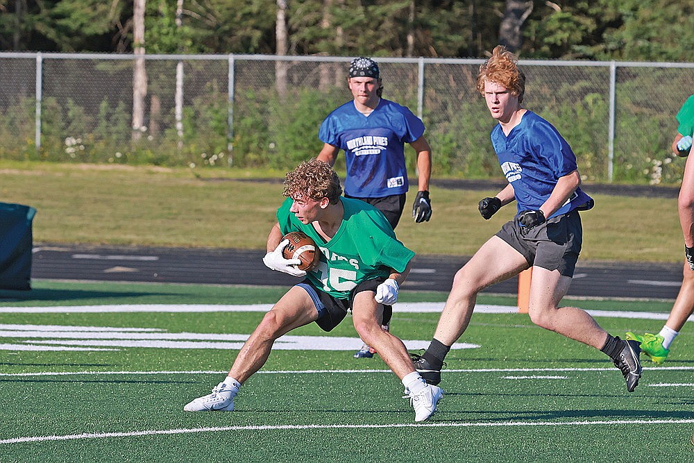 Rhinelander’s Ben Olson makes a spin move toward the end zone after catching a pass during a 7-on-7 football game against Northland Pines at Mike Webster Stadium Thursday, July 11. (Bob Mainhardt for the River News)