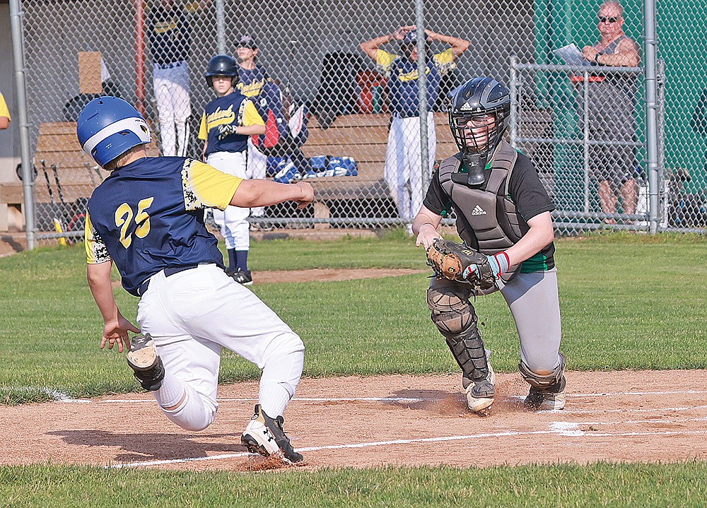 Rhinelander’s Johnny Baker looks to tag out a Tomahawk baserunner at home during the second inning of a Northwoods Babe Ruth Prep League game at Stafford Field Monday, July 15. (Bob Mainhardt for the River News)