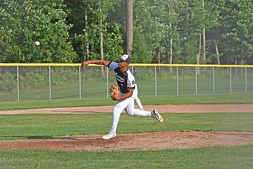 Max Keuer fires a pitch in the second inning of a 7-5 win over Eagle River Monday, July 15 at the Minocqua Park Complex. (Photo by Brett LaBore/Lakeland Times)