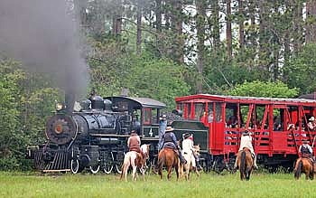 The passengers on the steam train experience a train robbery when the cowboys stop the train. It’s just a matter of time before the law arrives to stop the robbery. (Submitted photo)