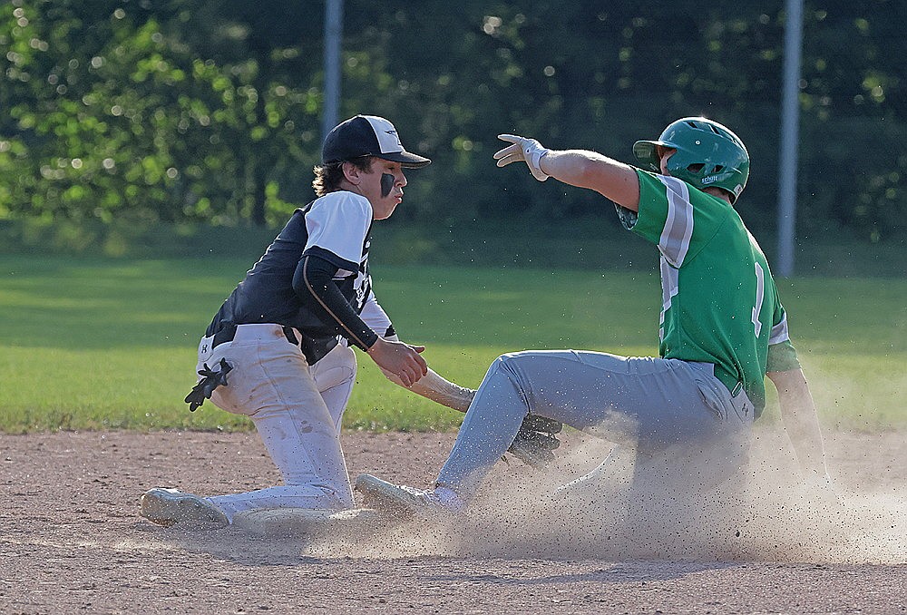 In this July 3, 2024 file photo, Rhinelander’s Dylan Vanderbunt steals a base ahead of the tag of Minocqua’s Cooper Johnson during an American Legion baseball game in Minocqua. Rhinelander and Minocqua will face each other this afternoon to kick off a four-team Class AA regional in Merrill. The double-elimination tournament will run through Sunday. (Bob Mainhardt for the River News)