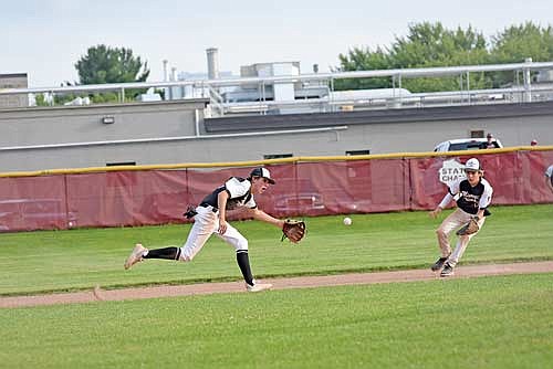 Cooper Johnson fields the ball before throwing to first base in the second inning against Marathon Friday, July 19 at Marathon High School. (Photo by Brett LaBore/Lakeland Times)