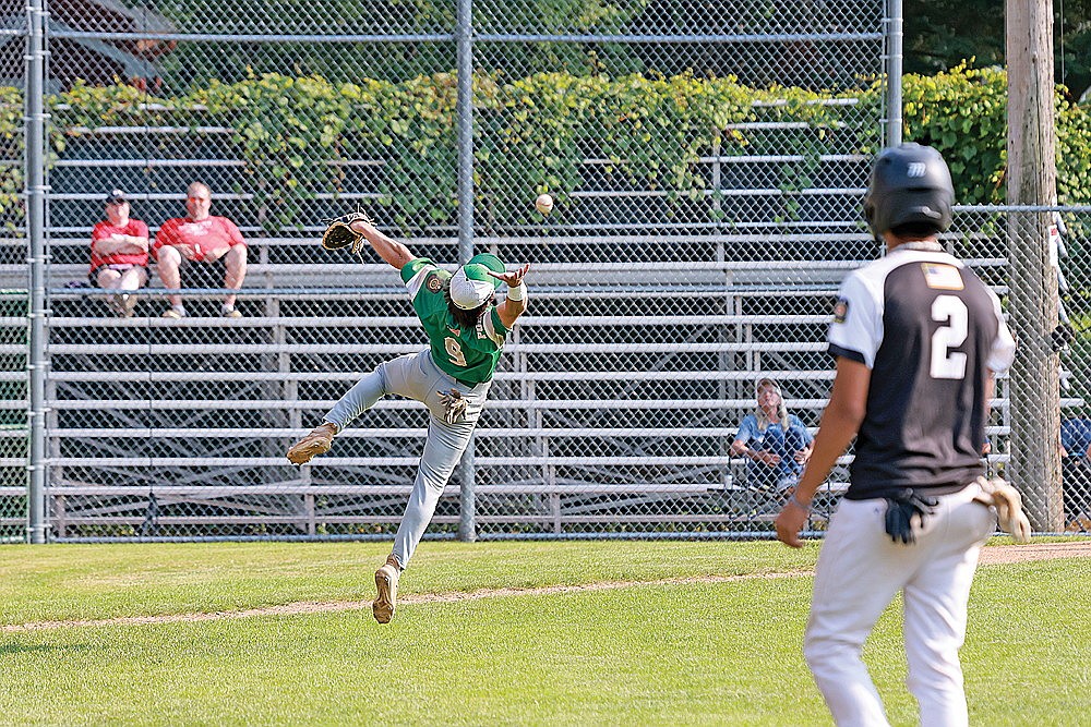 Rhinelander’s Adrian Patrone attempts to catch a pop fly by Minocqua’s Cooper Johnson during the second inning of an American Legion Class AA regional tournament game in Merrill Friday, July 26. (Bob Mainhardt for the River News)