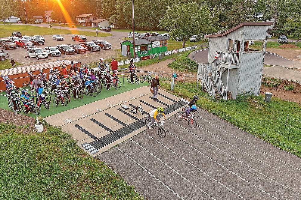 Riders leave the starting gate during a Hodag BMX Club race at West Side Park in Rhinelander Monday, July 29. The club is celebrating its 25th anniversary season and will hold a special race Saturday, Aug. 17 that will feature more than $4,800 in prize money in a handful of open classes. (Bob Mainhardt for the River News)