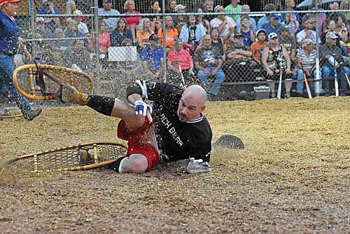 Tommy Ziamba of Black Bear Bar falls to the ground after a single to left in the sixth inning against the Snowhawks Monday, July 29 at Snowshoe Park in Lake Tomahawk. (Photo by Brett LaBore/Lakeland Times)