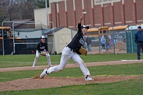 In this April 23, 2024 file photo, Ben Peterson throws a pitch with Drew Warren at first base against Tomahawk at the Lakeland Union High School baseball field in Minocqua. Peterson and Warren both threw no-hitters against Tomahawk in the same week. (Photo by Brett LaBore/Lakeland Times)