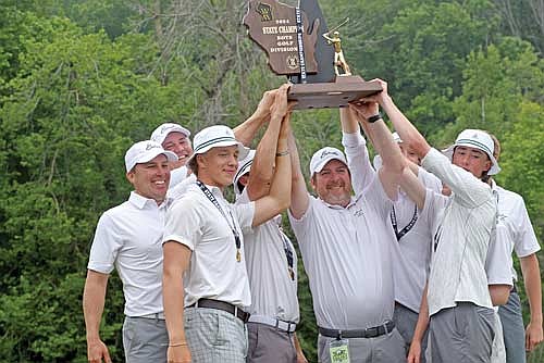 In this June 4, 2024 file photo, the Thunderbirds hoist the trophy up high after winning the WIAA Division 2 state championship at Blackwolf Run — Meadows Course in Kohler. Team pictured, from left, are assistant coach Matt Kock, assistant coach Peter Nomm, Jack Rubo, Matt Haggart, coach Scott Howard, Jeremy Hensen, Gray Wagner, Lawson Bain and Davis Kock. (Photo by Brett LaBore/Lakeland Times)