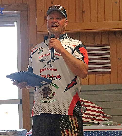 Tournament organizer and Army veteran Kris Hanes addressed the crowd at the Sara Park Complex before beginning the awards ceremony for the 8th Annual Veterans on Water Bass Tournament. (Photo by Beckie Gaskill/Lakeland Times)