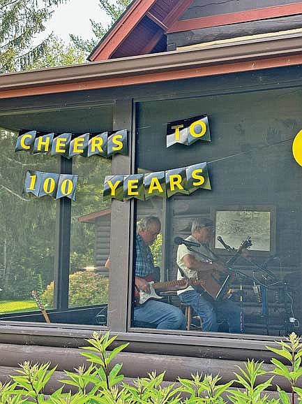 The band Comstock Lode featuring Peter Nomm, left, and Greg Wright plays during Trout Lake Golf Club’s 100-year anniversary party Friday, July 12 in Arbor Vitae. (Photo by Brett LaBore/Lakeland Times)