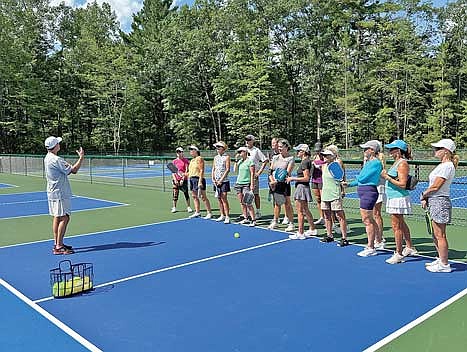 World renowned pickleball professional Dave Weinbach, left, instructs a pickleball clinic at the new Manitowish Waters Pickleball Complex on Saturday, Aug. 3. (Contributed photograph)