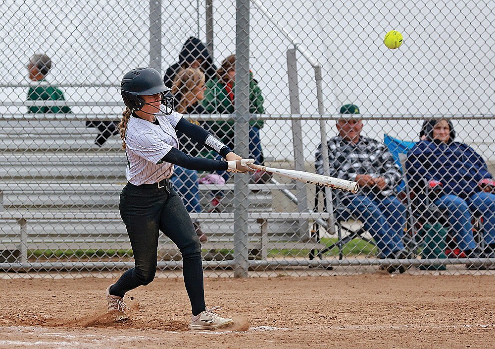 Ruby Plamann hits a fly ball during a 14U game.