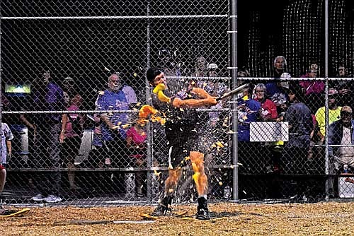 Skyler Giampa, from the local police/fire department team Guns & Hoses, hits the melon ball in the seventh inning Monday, Aug. 12 at Snowshoe Park in Lake Tomahawk. (Photo by Brett LaBore/Lakeland Times)