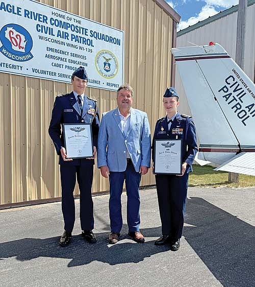 Civil Air Patrol Cadet Captain Attila Gyuro, left, Wisconsin state representative Rob Swearingen and Civil Air Patrol Cadet Lieutenant Colonel Kristiana Clay following a ceremony honoring Gyuro and Clay at the Eagle River Airport on Aug. 11. (Contributed photograph)