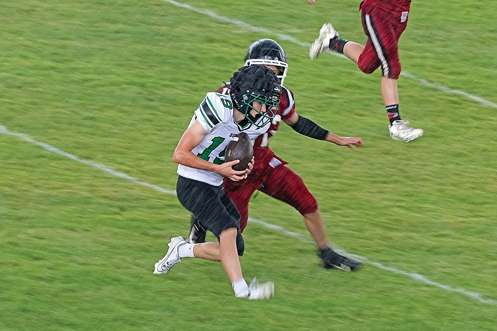 Rhinelander’s Ryley Hull catches a pass in the rain during a football scrimmage at Crandon Friday, Aug. 16. The Hodags got in roughly half of their scheduled five-team scrimmage on Friday before it was suspended, and ultimately canceled, due to inclement weather. (Jeremy Mayo/River News)