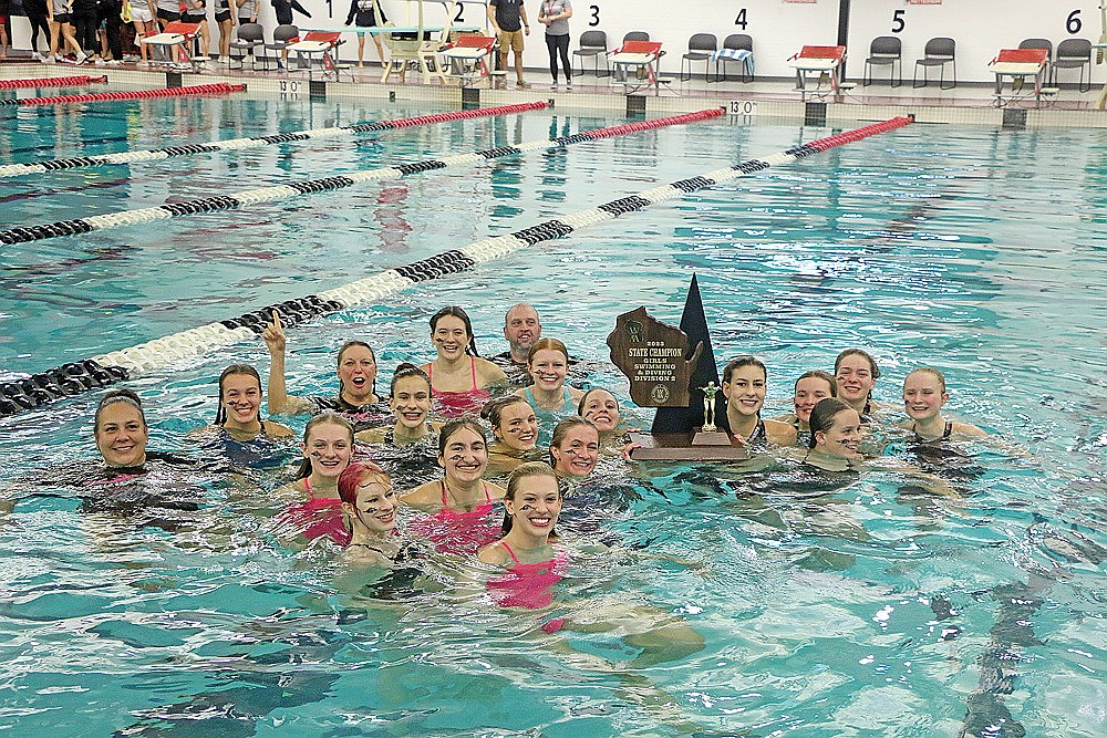 In this Nov. 10, 2023 file photo, the Rhinelander High School girls’ swim team celebrates in the pool after winning the WIAA Division 2 state championship in Waukesha. The Hodags bring back eight swimmers who competed in Waukesha last November, including five who were part of at least one event win. (Jeremy Mayo/River News)