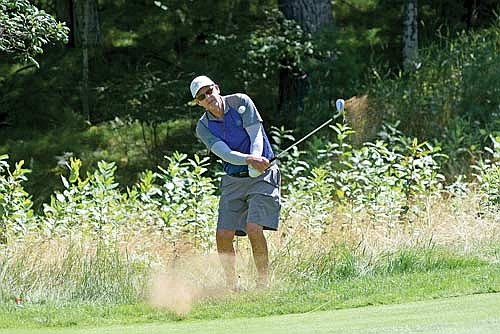 Mike Murphy hits his shot out of the rough at the 10th hole of the Wisconsin State Open Tuesday, Aug. 20 at Minocqua Country Club. (Photo by Brett LaBore/Lakeland Times)