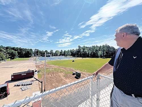 LUHS district administrator Bob Smudde looks out over the practice football field at the resurfaced tennis courts on Thursday, Aug. 22, in Minocqua. (Photo by Trevor Greene/Lakeland Times)