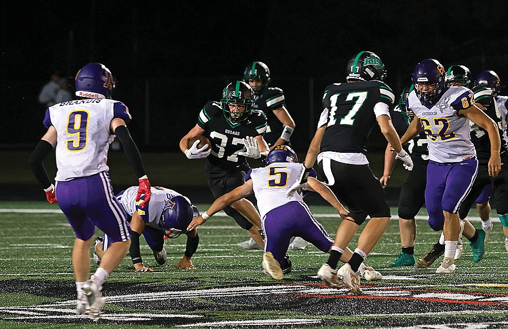 Rhinelander’s Cyrus Leisure breaks a tackle attempt by Ashland’s Justin Defoe during the third quarter of a non-conference football game at Mike Webster Stadium Friday, Aug. 23. Leisure scored a 63-yard touchdown on the play as the Hodags defeated the Oredockers, 20-0. (Bob Mainhardt for the River News)