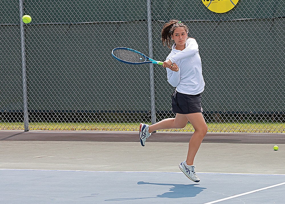 Rhinelander’s Karmen Lopez hits a return during a girls’ tennis match against Ironwood, Mich. at the RHS tennis courts Friday, Aug. 23. (Bob Mainhardt for the River News)