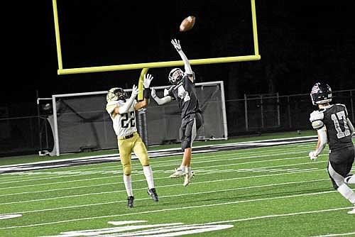 Tyson Redman defends a pass intended for Hayward’s Xzavier Stojek during the third quarter Friday, Aug. 23 at IncredibleBank Field in Minocqua. (Photo by Brett LaBore/Lakeland Times)