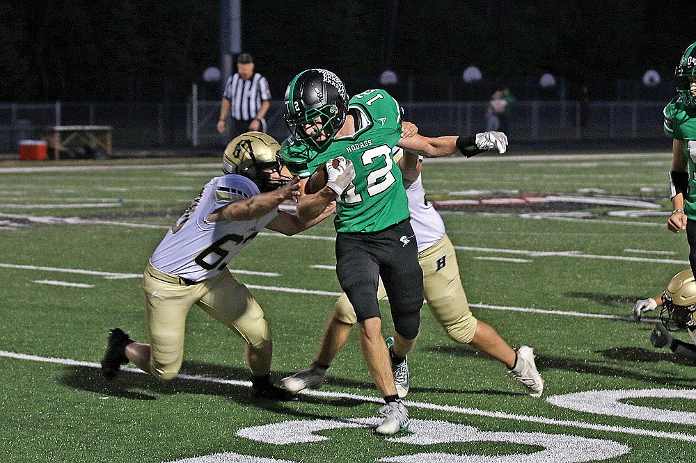 In this Sept. 8, 2023 file photo, Rhinelander’s Truman Lamers looks to break a tackle attempt of two Hayward defenders during a GNC football game at Mike Webster Stadium. Lamers and the Hodags will look to move to 2-0 on the season tonight as the face the Hurricanes, now a member of the Heart O’ North Conference, in Hayward. (Bob Mainhardt for the River News)