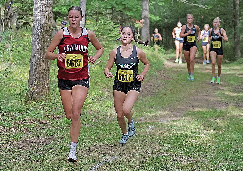 Rhinelander’s Brynn Teter, right, races Crandon’s Maya Quade during the Hodag Invite cross country race in Rhinelander Thursday, Aug. 29. Teter led the Hodag girls with a seventh-place finish as the team took fourth out of nine qualifying squads in the meet. (Jeremy Mayo/River News)