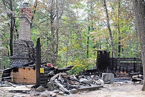 The remains of a log cabin on Bills Lake Road in Lac du Flambeau that burned in the early morning hours of Monday, Aug. 26. The owners of the structure, who purchased it in 2011, plan to rebuild. (Photo by Brian Jopek/Lakeland Times)